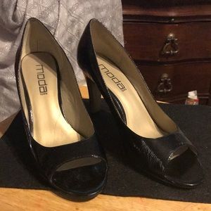 MODA SPANA two inch heel with peep toes; black patent and gold heel